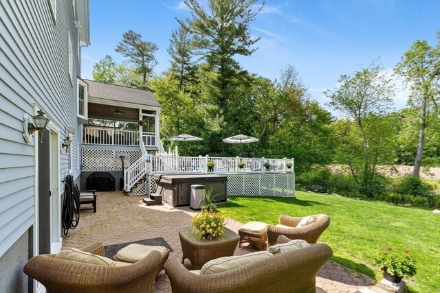 51 Lilah Ln, Reading, MA 01867 - view of yard with a hot tub, a patio area, a sunroom, and a wooden deck
