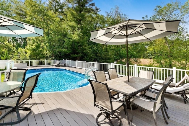 51 Lilah Ln, Reading, MA 01867 - view of pool with a wooden deck, outdoor dining space, and view of scattered trees