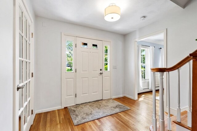 51 Lilah Ln, Reading, MA 01867 - entrance foyer with light wood-type flooring, baseboards, and stairs