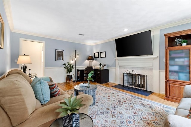 51 Lilah Ln, Reading, MA 01867 - living room with a fireplace with flush hearth, wood finished floors, and ornamental molding