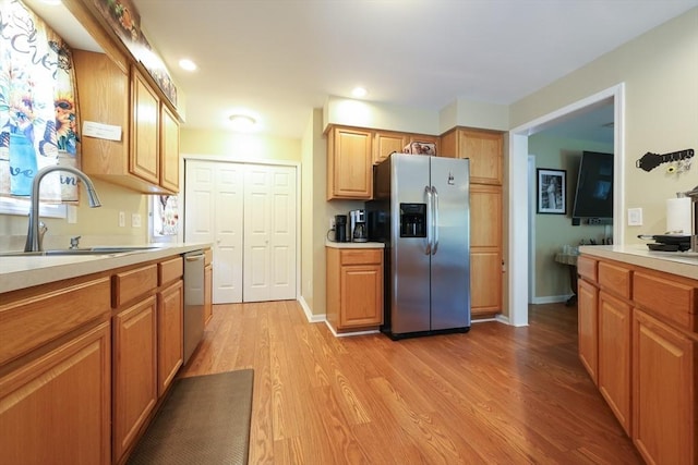 4 Colonial Rd, Webster, MA 01570 - kitchen featuring appliances with stainless steel finishes, light wood-type flooring, light countertops, recessed lighting, and brown cabinets