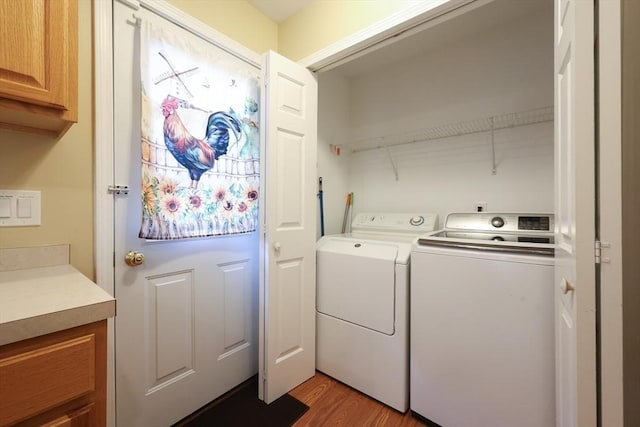 4 Colonial Rd, Webster, MA 01570 - laundry room featuring washing machine and clothes dryer and light wood-style flooring