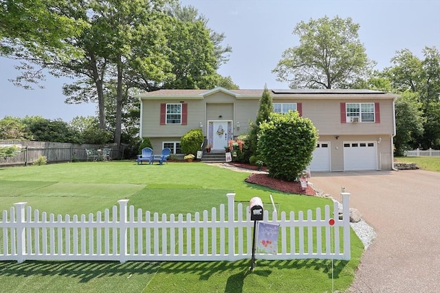 4 Colonial Rd, Webster, MA 01570 - bi-level home with a garage, asphalt driveway, and solar panels