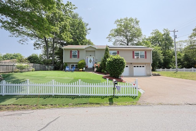 4 Colonial Rd, Webster, MA 01570 - raised ranch featuring an attached garage, asphalt driveway, solar panels, a fenced front yard, and entry steps