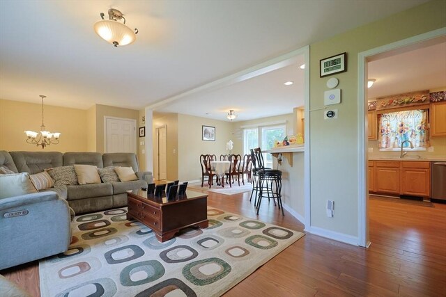 4 Colonial Rd, Webster, MA 01570 - living area with a chandelier and wood finished floors
