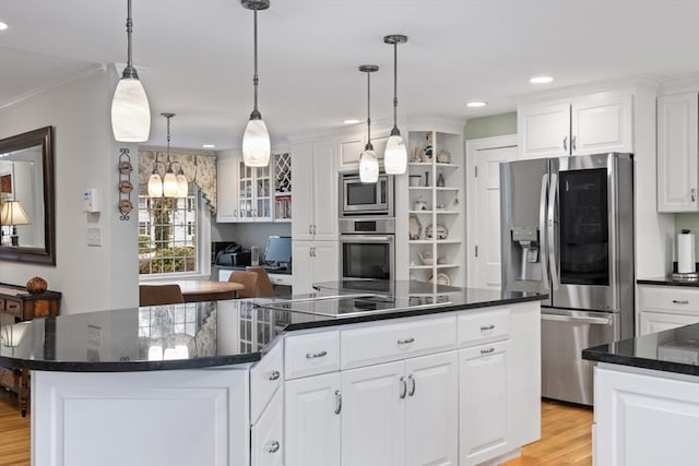 kitchen with open shelves, stainless steel appliances, a spacious island, light wood-style floors, and white cabinets