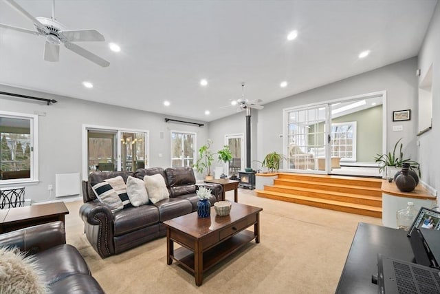 living area featuring plenty of natural light, a ceiling fan, and recessed lighting