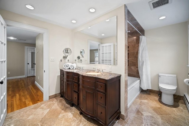 full bath with visible vents, toilet, shower / tub combo, vanity, and baseboards