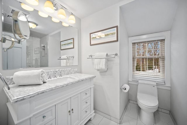 bathroom featuring marble finish floor, toilet, a shower stall, vanity, and baseboards