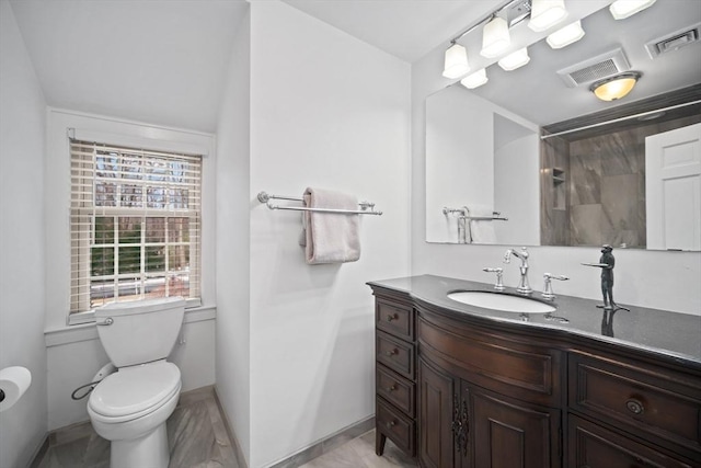 full bathroom with visible vents, vanity, toilet, and walk in shower