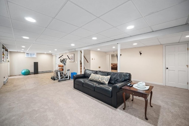 living area with a paneled ceiling, recessed lighting, carpet flooring, baseboards, and stairway