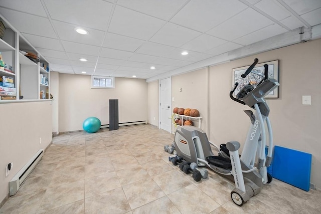 exercise area featuring baseboard heating, a drop ceiling, tile patterned flooring, and recessed lighting