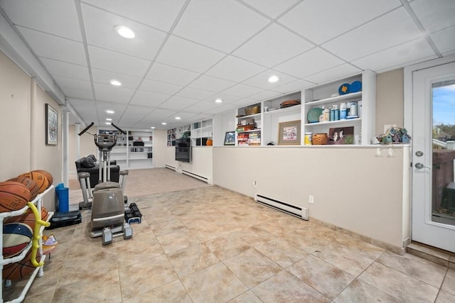 exercise area with a baseboard radiator, a drop ceiling, and recessed lighting