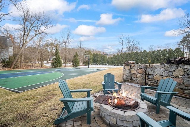 exterior space featuring community basketball court and a lawn