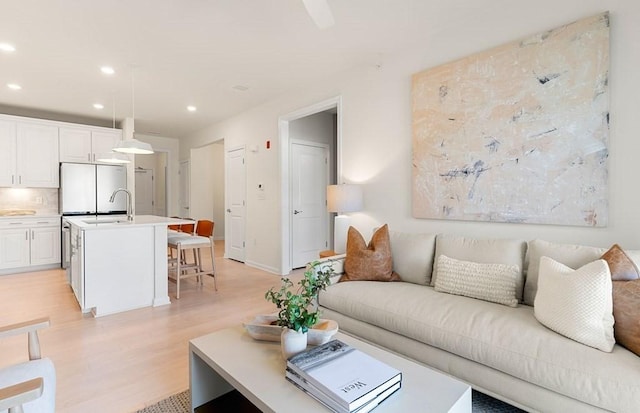 2 Codman Way Unit 311, Westborough, MA 01581 - living room featuring light wood-style flooring, recessed lighting, and baseboards