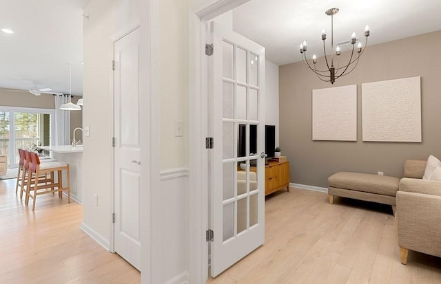 2 Codman Way Unit 311, Westborough, MA 01581 - living area featuring light wood-type flooring, baseboards, a chandelier, a ceiling fan, and recessed lighting