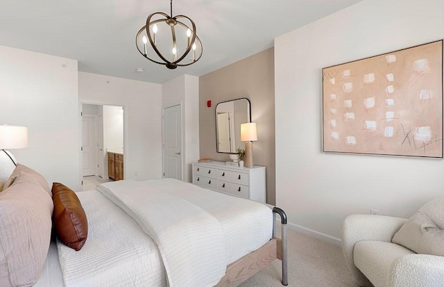 2 Codman Way Unit 311, Westborough, MA 01581 - bedroom with light carpet, a chandelier, baseboards, and ensuite bathroom