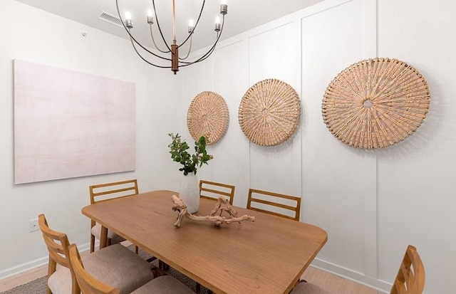 2 Codman Way Unit 311, Westborough, MA 01581 - dining room featuring a chandelier, wood finished floors, and baseboards