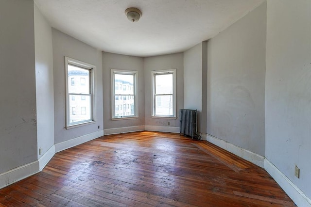 107 Devon St, Boston, MA 02121 - spare room with radiator and wood-type flooring