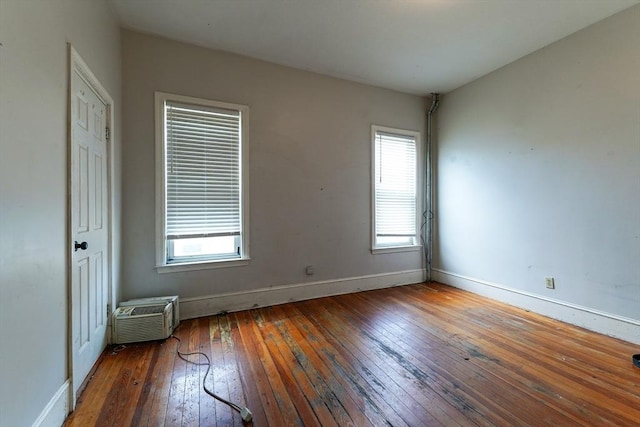 107 Devon St, Boston, MA 02121 - unfurnished room with hardwood / wood-style floors, plenty of natural light, and a wall mounted air conditioner