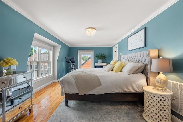 37-1/2 Federal St, Newburyport, MA 01950 - bedroom featuring crown molding, multiple windows, wood finished floors, baseboards, and a chandelier