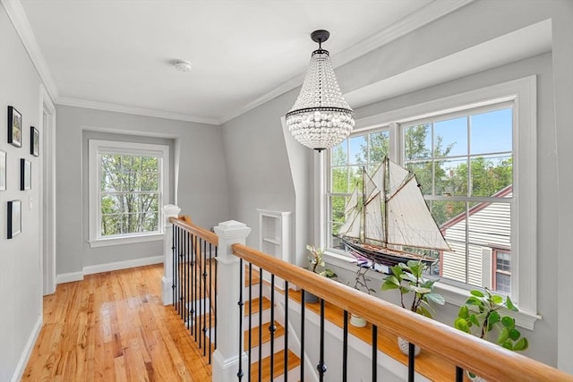 37-1/2 Federal St, Newburyport, MA 01950 - hall featuring an upstairs landing, a chandelier, light wood-style flooring, baseboards, and crown molding