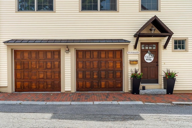 37-1/2 Federal St, Newburyport, MA 01950 - property entrance featuring a garage, a standing seam roof, and metal roof