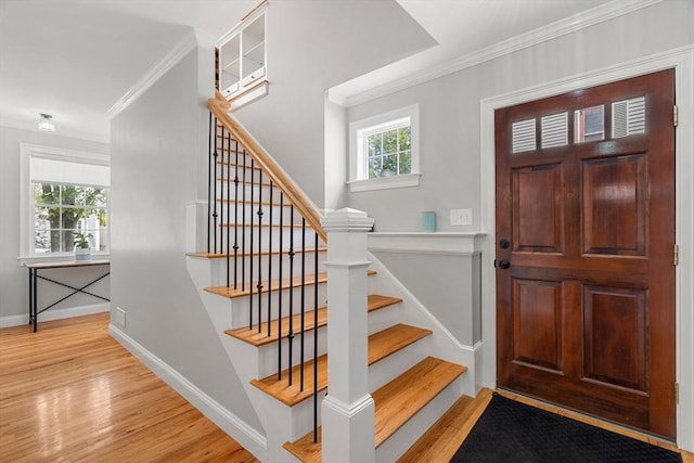 37-1/2 Federal St, Newburyport, MA 01950 - foyer featuring crown molding, light wood-type flooring, stairs, and baseboards