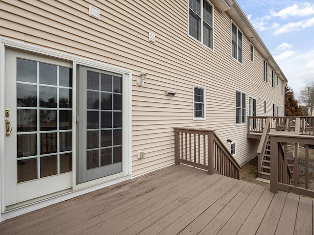 wooden terrace featuring stairway