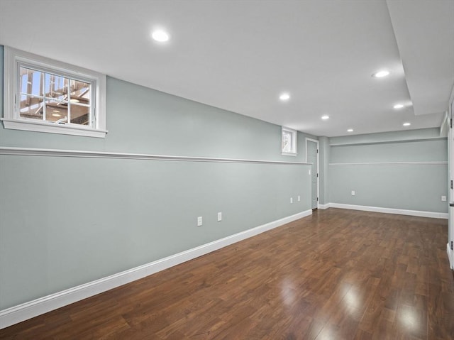 below grade area featuring recessed lighting, baseboards, and wood finished floors