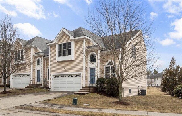 traditional-style house with driveway and an attached garage