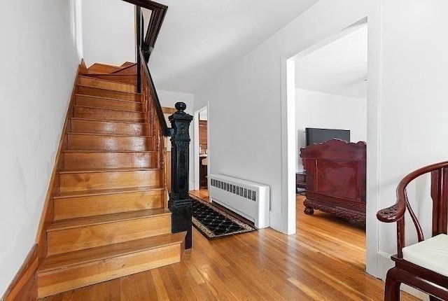 21 Parker St, Boston, MA 02129 - stairway featuring radiator heating unit and wood finished floors