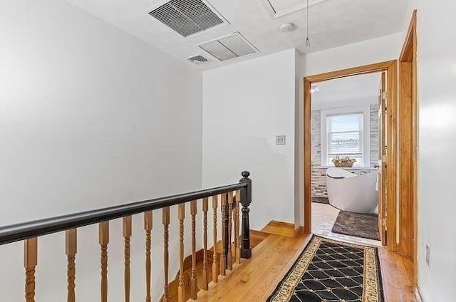 21 Parker St, Boston, MA 02129 - hallway featuring attic access, an upstairs landing, and light wood-style flooring