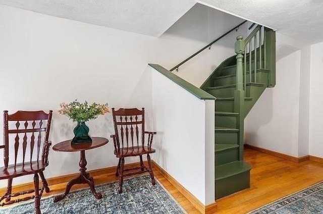 21 Parker St, Boston, MA 02129 - staircase featuring wood finished floors and baseboards