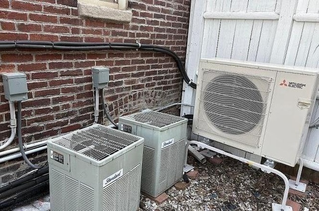 21 Parker St, Boston, MA 02129 - exterior view of brick siding, central air condition unit, and a cooling unit