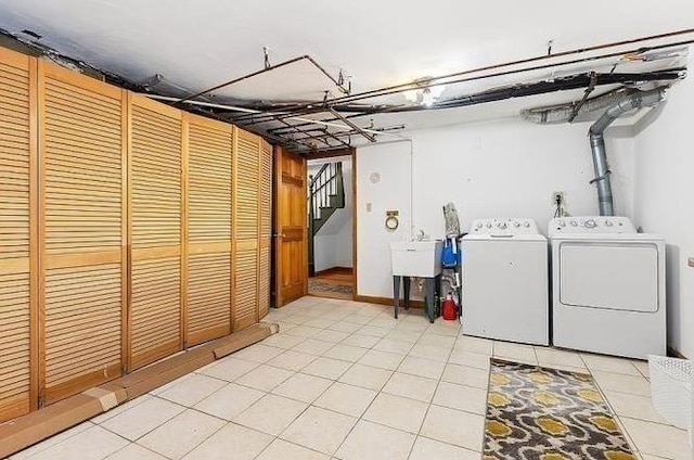 21 Parker St, Boston, MA 02129 - laundry area featuring washer and dryer and light tile patterned floors