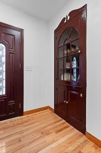 21 Parker St, Boston, MA 02129 - entryway featuring baseboards and light wood-style flooring