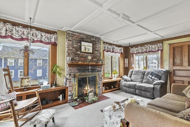 carpeted living room with a fireplace, wooden walls, and coffered ceiling