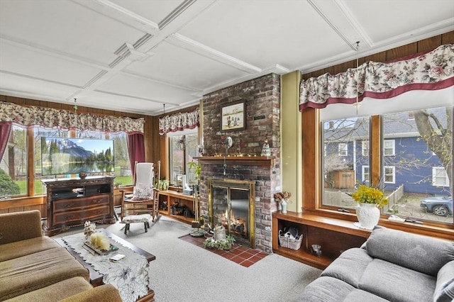 living room featuring a brick fireplace, coffered ceiling, and carpet