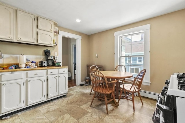 dining room with baseboards, recessed lighting, and a baseboard radiator