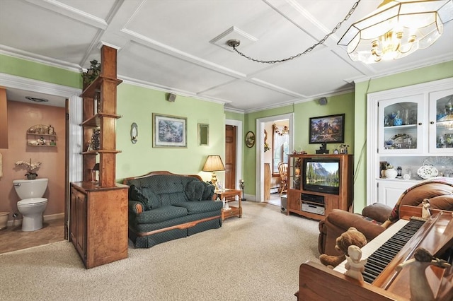 carpeted living room featuring ornamental molding, a notable chandelier, and baseboards