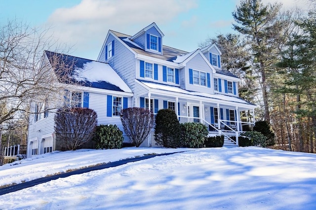 view of front facade with a garage and covered porch