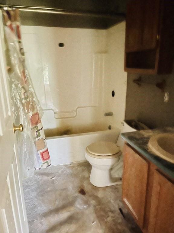 bathroom featuring toilet, unfinished concrete floors, shower / bath combination with curtain, and vanity