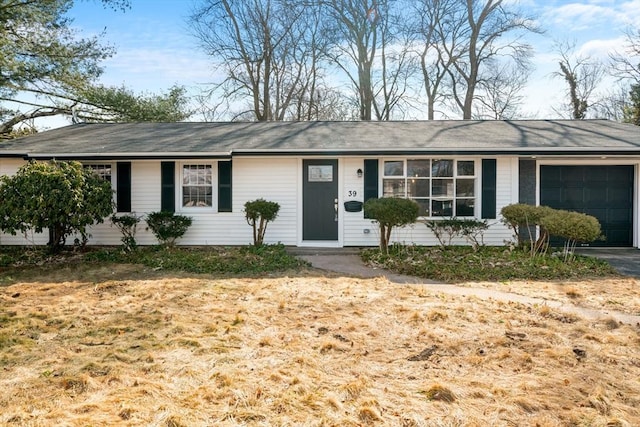 ranch-style home with an attached garage and driveway