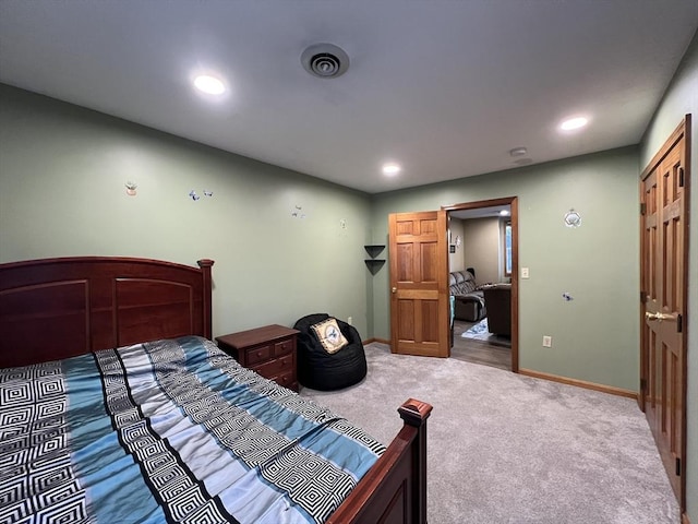 bedroom with carpet and a closet