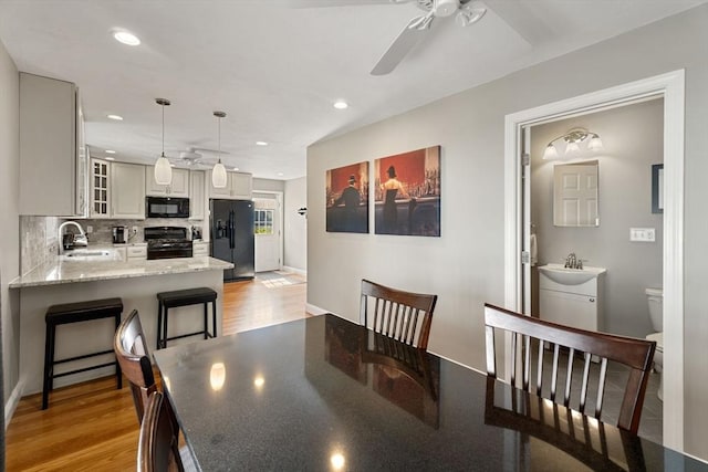 63 Prospect St Unit 2, Woburn, MA 01801 - dining room featuring ceiling fan, light wood-style flooring, recessed lighting, and baseboards