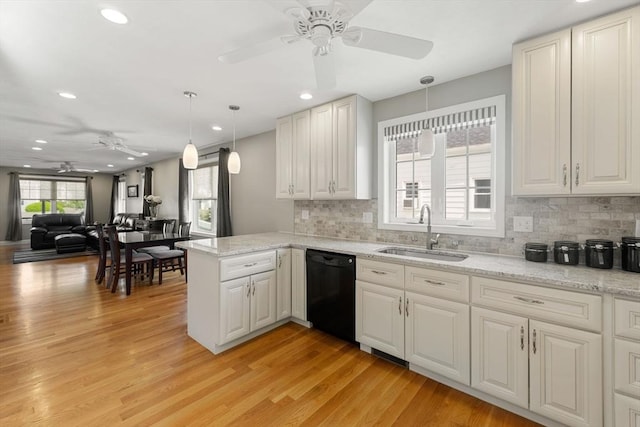 63 Prospect St Unit 2, Woburn, MA 01801 - kitchen with a sink, black dishwasher, a ceiling fan, light wood-style floors, and recessed lighting