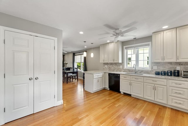 63 Prospect St Unit 2, Woburn, MA 01801 - kitchen with black dishwasher, a sink, ceiling fan, backsplash, and recessed lighting