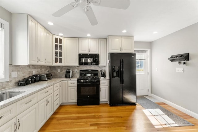 63 Prospect St Unit 2, Woburn, MA 01801 - kitchen featuring black appliances, a ceiling fan, tasteful backsplash, light wood-type flooring, and recessed lighting