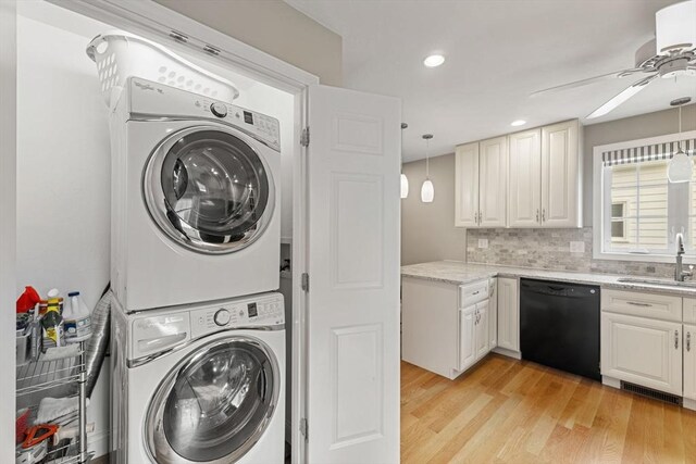 63 Prospect St Unit 2, Woburn, MA 01801 - washroom featuring stacked washer / dryer, a ceiling fan, light wood finished floors, and recessed lighting
